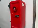 a red fire hydrant mounted to the wall of a bathroom