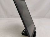 a tablet that is sitting on a stand on a table