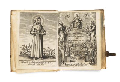 un vieux livre sur lequel figure l'image d'un homme tenant une croix et un livre sur lequel figure l'image d'un homme tenant une croix