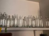 a lot of empty glass bottles on a shelf