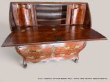 a wooden desk with a drawer on top of it