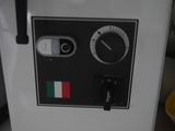 a machine that is sitting on the counter in the kitchen