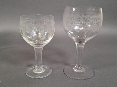 two wine glasses sitting next to each other on a table