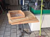 a small table with a broom on it in the kitchen