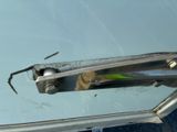 a spider that is sitting on the side of a car
