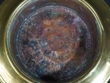 a close up of a metal bowl on a table