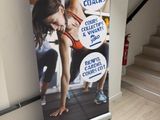 a roll up banner with a woman doing a yoga pose on it