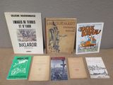 several books sitting on a table next to each other on top of a table