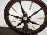 a spinning wheel with a lot of wooden pieces on it