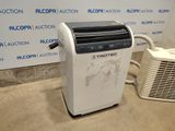a white air conditioner sitting next to a white air conditioner