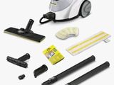 a close up of a vacuum cleaner with cleaning supplies on a white background