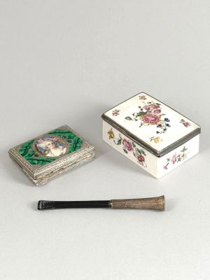 a small box with a picture of a woman on it next to a small box with a baseball bat