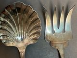 two spoons and a fork sitting on a table