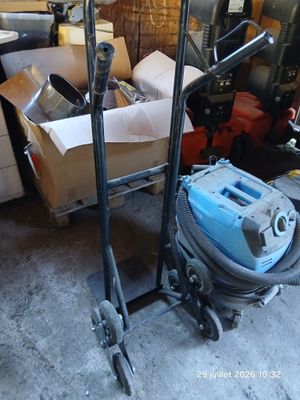 an image of a cart with a vacuum on it in a garage