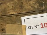 a lot n 102 sign on the side of a building