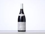 a bottle of wine that is sitting on a table