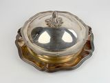 an antique silver plate with a glass dome on top of it