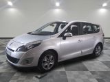 a picture of a silver minivan parked in a room