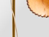 a close up of a lamp on a table with a white background