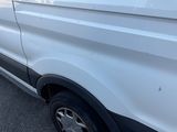 a white van parked on the side of the road
