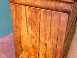 a wooden table with a drawer on top of it