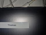 a picture of a close up of a laptop with a name tag
