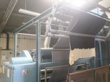 a machine that is working on a sheet of paper