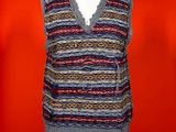 a woman ' s sweater vest on a mannequin mannequin mannequin mannequin mannequin mannequin mannequin mannequin