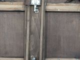 a close up of a wooden barrel with a metal latch