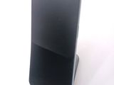 a cell phone that is sitting on top of a stand