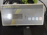 a close up of a digital scale on a table