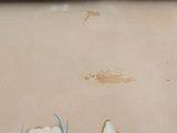 painting of three white flowers in a wooden frame on a wall
