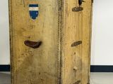 an old suitcase sitting on the floor in a room