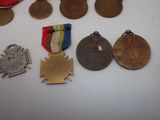 many medals and medals that are on the table