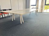 a table and chairs in a room with a large window