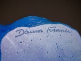 a blue and white teddy bear with a name on it