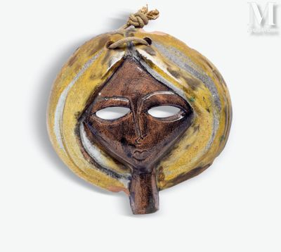 an image of a brown and yellow mask on a white background