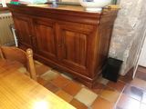 a wooden table with a bowl on top of it