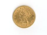 une pièce d'or ornée d'une tête de femme