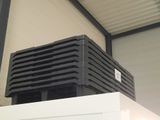 a black box sitting on top of a white refrigerator