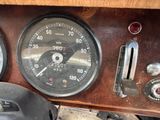 a close up of a speedometer and gauges on a vehicle