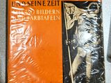 un livre sur lequel figure la photo d'un homme tenant un drapeau
