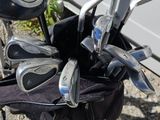 a close up of a golf bag with golf clubs in it