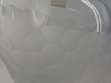 a glass vase that is sitting on a table