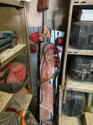 a small room with a bunch of tools on the shelves