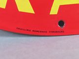 a close up of a red and yellow plate with the letters aa on it