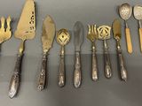 several different types of silverware including spoons, forks and spoons