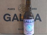 a bottle of beer sitting next to a cardboard box