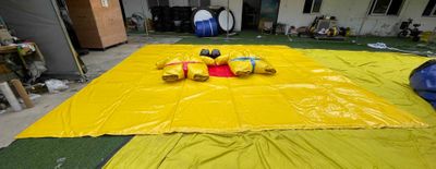 a large yellow tarp with a stuffed animal on it