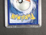 a pokemon card in a plastic container on a table